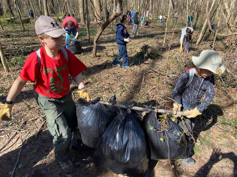 Scouts hauling brush on a service day